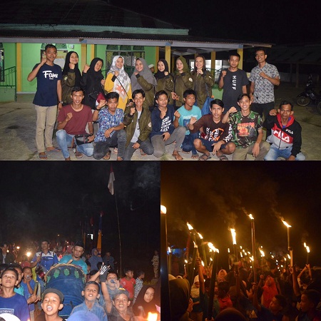 Pawai Obor Keliling Desa Sungai Sitolang, Mahasiswa KKN UR LIbatkan Warga Setempat
