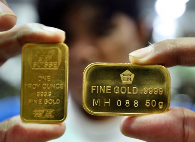 Harga Emas Antam Turun Rp7.000/Gram 