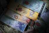Obligasi Pemerintah Memperlemah Nilai Tukar Ringgit
