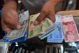 IHSG Tergelincir, Rupiah Menguat Tipis'