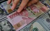 Terpapar Sentimen BI, Rupiah Melemah Rp14.092 per Dolar AS